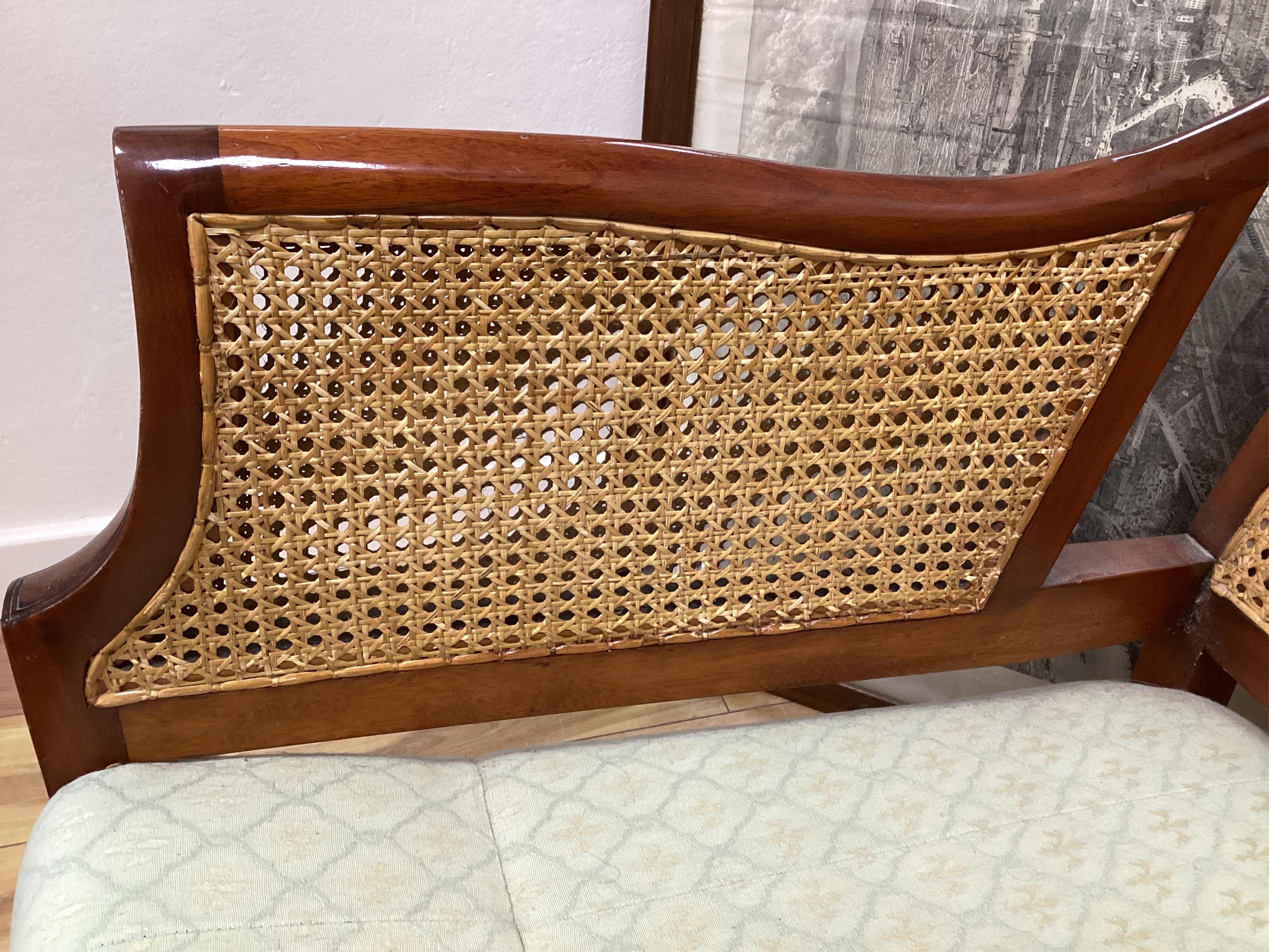 A mahogany double caned bergere settee with loose cushion seat and back, width 178cm, depth 78cm, height 87cm